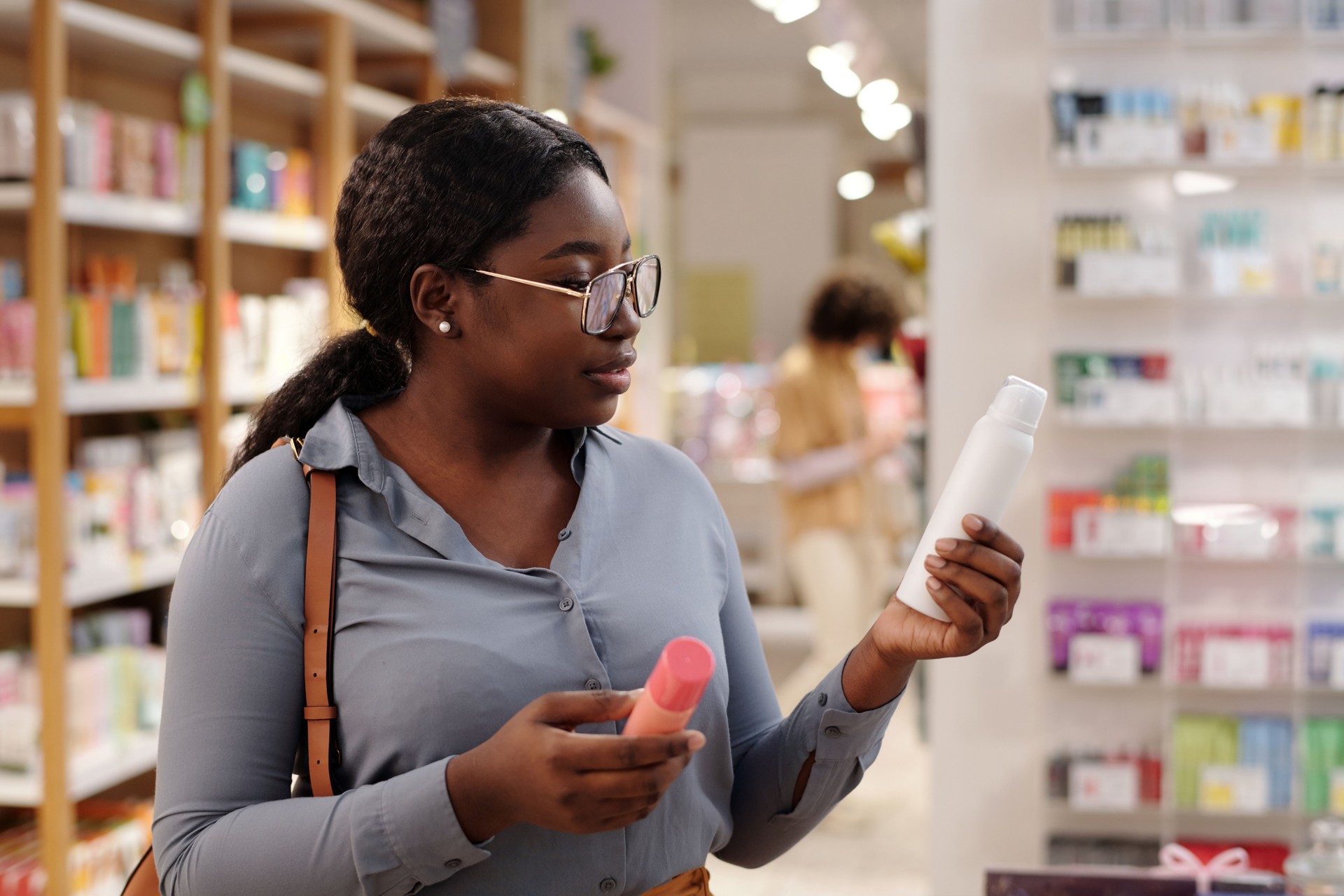 Young woman choosing deodorant